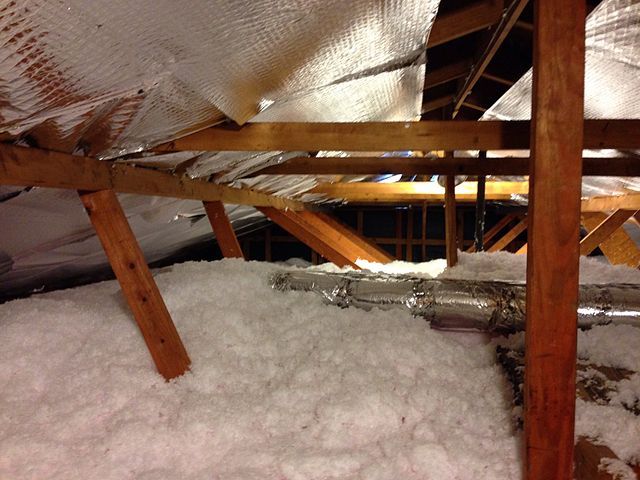 An attic in Littleton, CO with blown in insulation